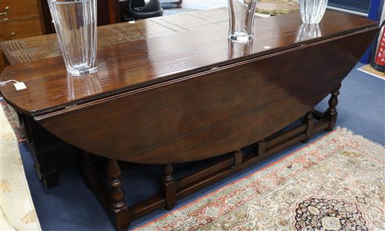 An 18th century style wake table on turned underframe, L.230cm